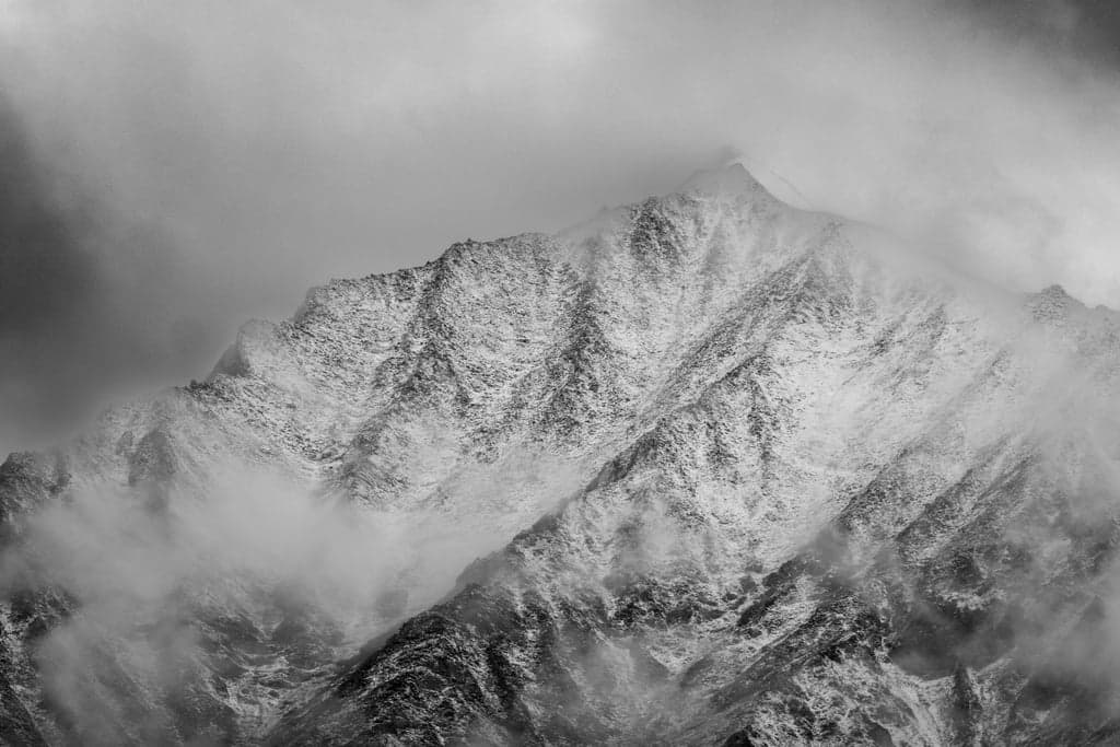 Snow-dusted mountain ridge in black and white, Ladakh